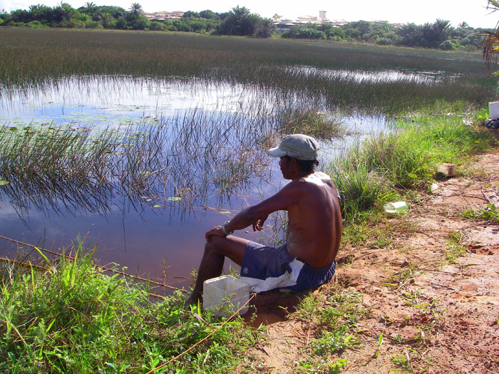 Here's the man himself.  The polystyrene box contains his shrimp baits and is carefully placed in the shade of his body.